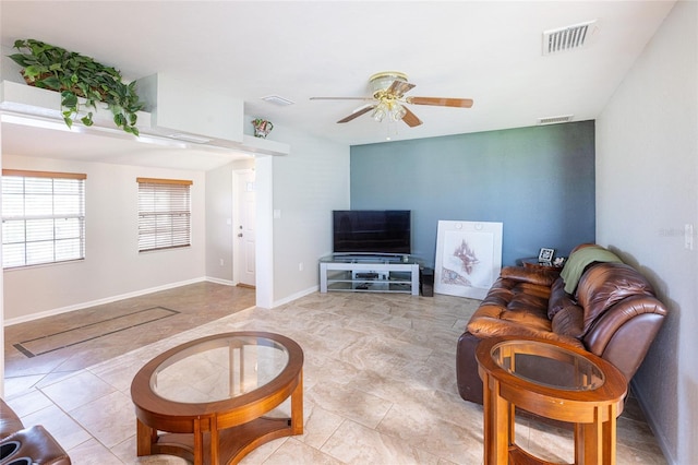 living room featuring ceiling fan