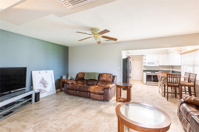 living room with ceiling fan