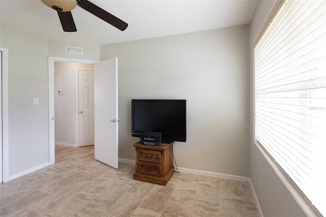 unfurnished bedroom featuring ceiling fan