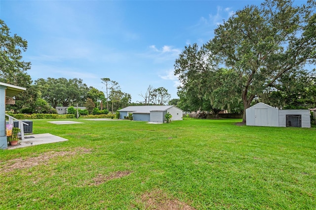 view of yard with central AC and a storage unit