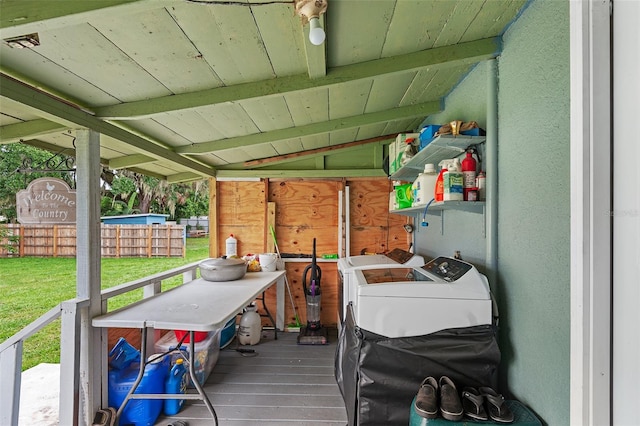 exterior space with a yard and washing machine and clothes dryer