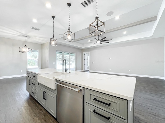 kitchen with gray cabinetry, dishwasher, a center island, dark wood-type flooring, and hanging light fixtures
