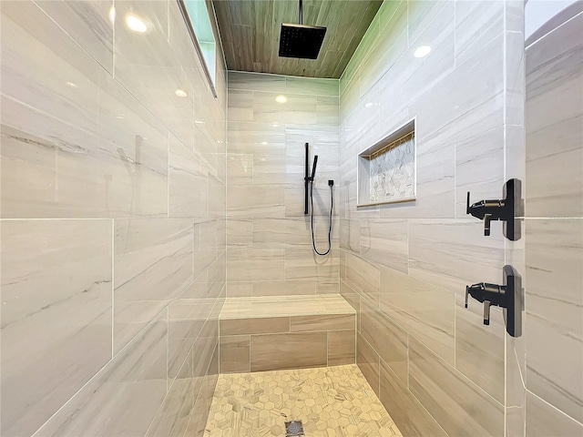 bathroom with tiled shower