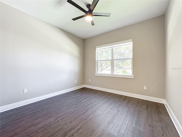 unfurnished room featuring ceiling fan and dark hardwood / wood-style floors