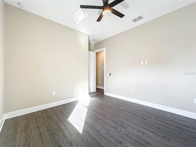 spare room with ceiling fan and dark hardwood / wood-style floors
