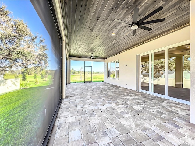 unfurnished sunroom featuring wood ceiling
