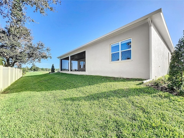 rear view of property with a yard