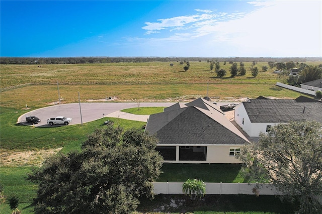 birds eye view of property with a rural view
