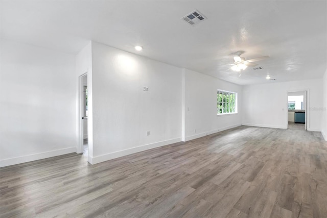 unfurnished room with ceiling fan and light hardwood / wood-style floors