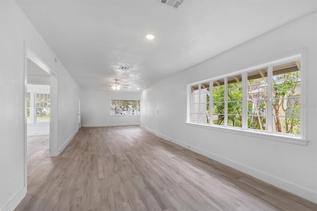 empty room featuring ceiling fan and light wood-type flooring