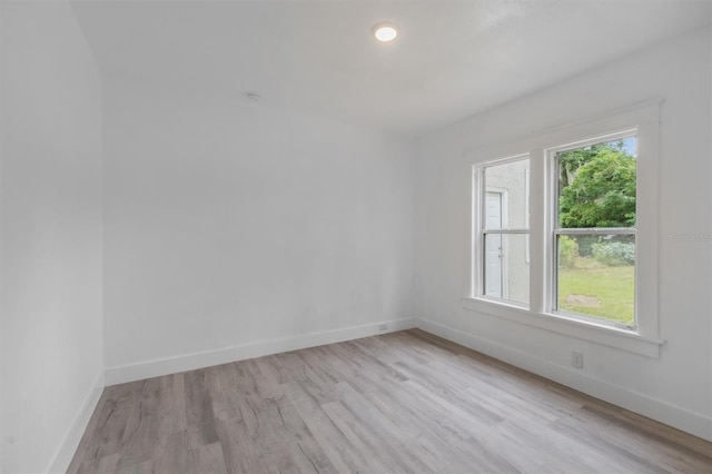 unfurnished room featuring light hardwood / wood-style floors