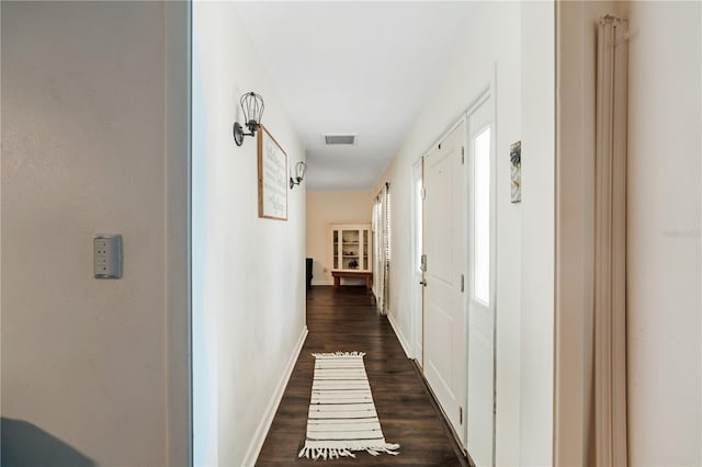 hall with dark wood-type flooring