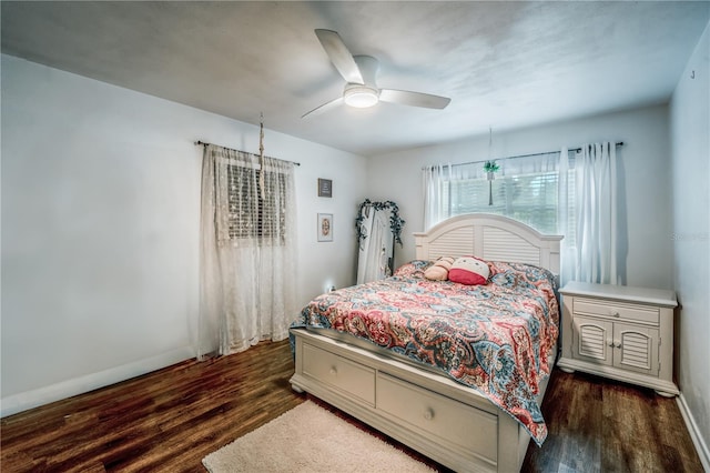 bedroom featuring dark wood-type flooring and ceiling fan