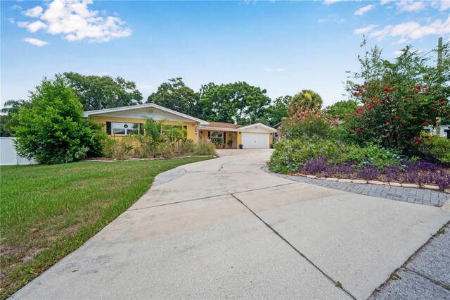 single story home with a front lawn