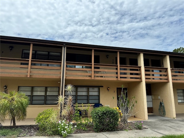 view of front of home with a balcony