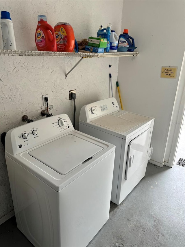 laundry area with separate washer and dryer