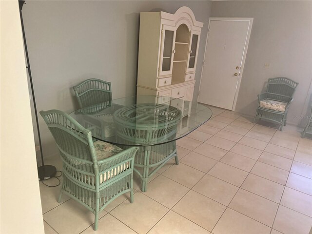 dining area featuring light tile patterned flooring