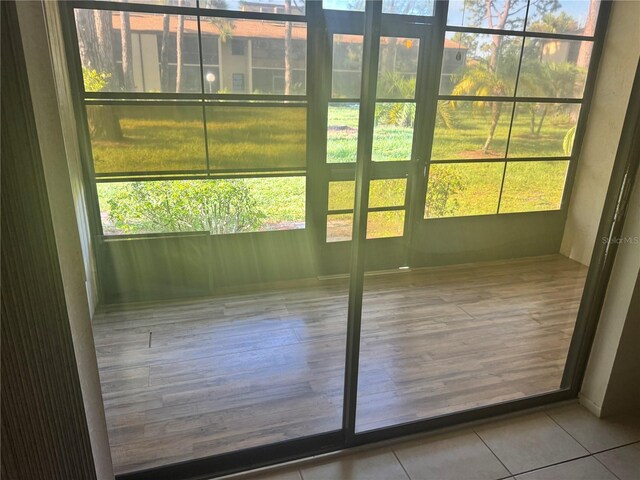 entryway with light tile patterned floors