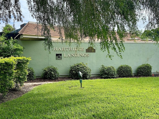 view of side of home featuring a yard