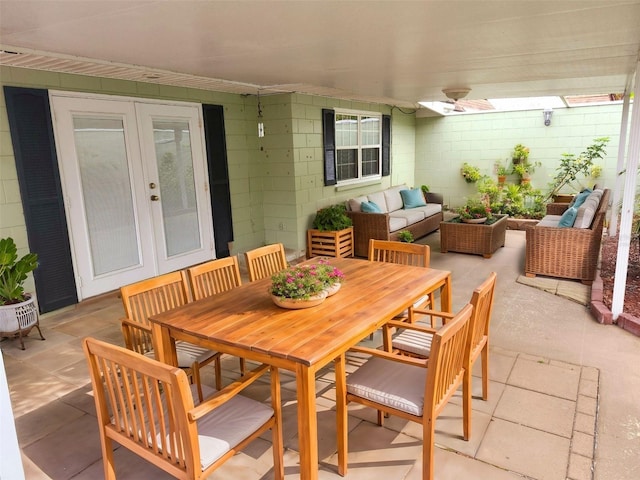 view of patio / terrace with outdoor dining area, outdoor lounge area, and french doors