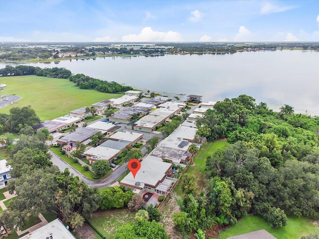 drone / aerial view with a residential view and a water view