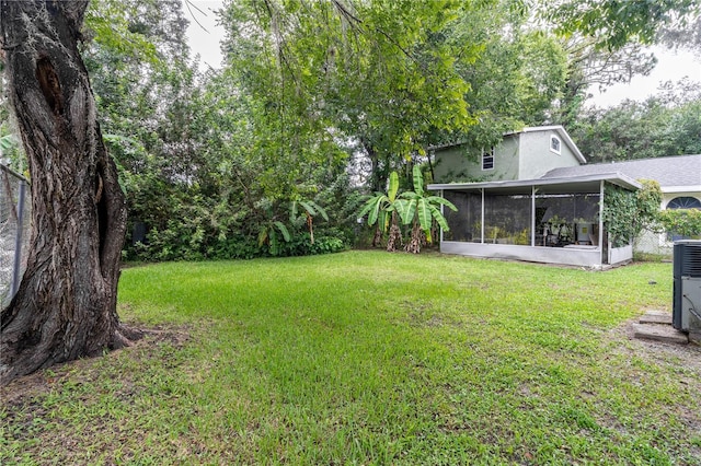 view of yard featuring a sunroom