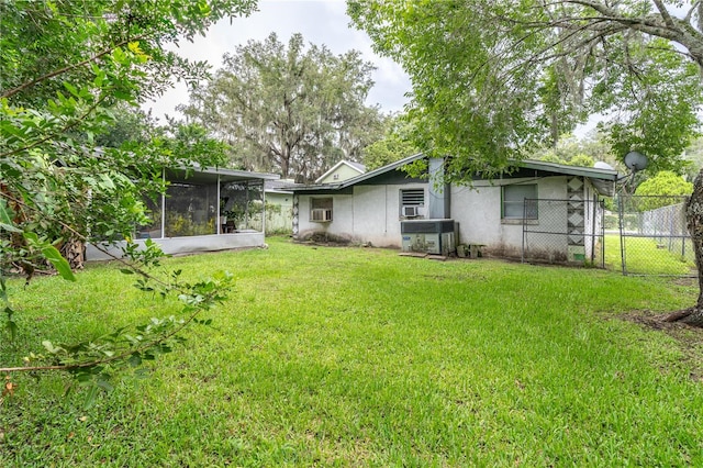 view of yard with a sunroom