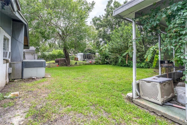 view of yard with central air condition unit and ac unit