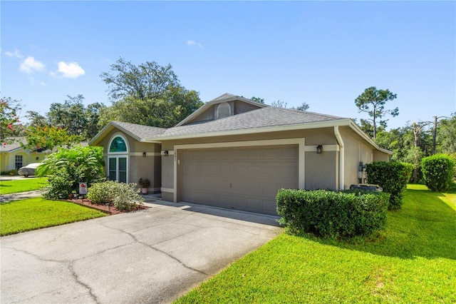 single story home featuring a front lawn and a garage