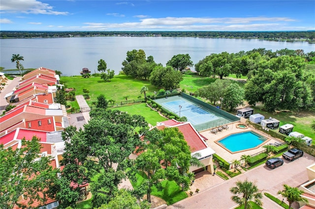 birds eye view of property with a water view