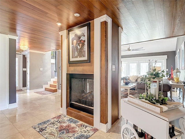 interior space featuring light tile patterned floors and wood ceiling