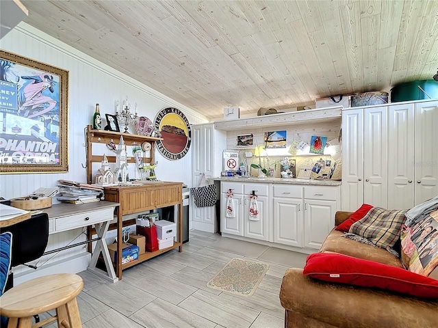 kitchen featuring lofted ceiling, white cabinets, and wooden ceiling