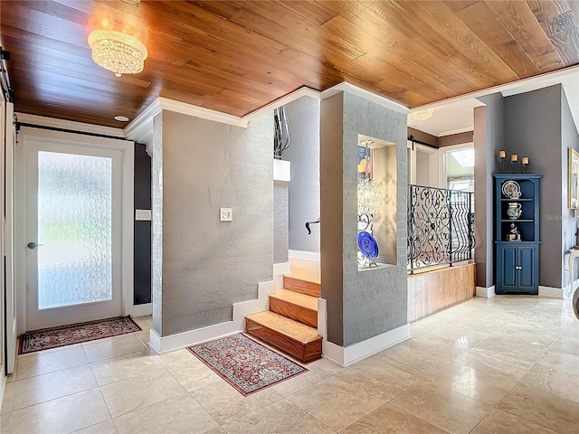 foyer entrance featuring crown molding, wooden ceiling, and light tile patterned floors
