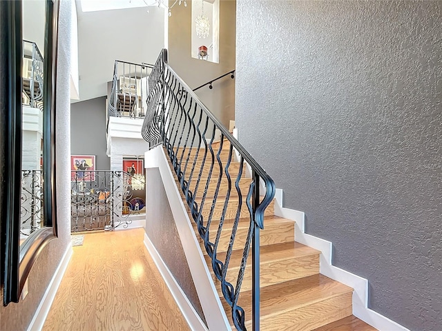 stairway featuring wood-type flooring