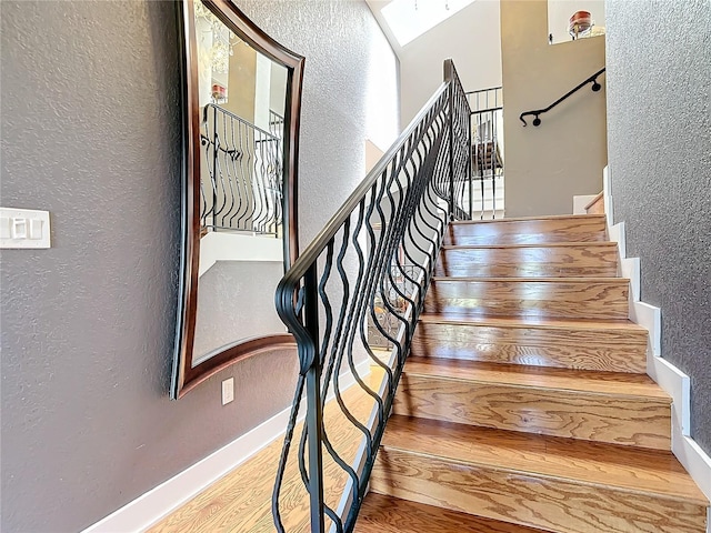 stairs with wood-type flooring