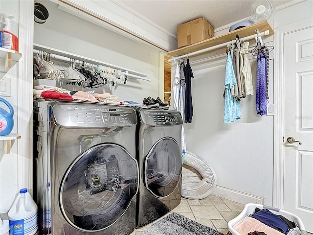 laundry area with washing machine and clothes dryer