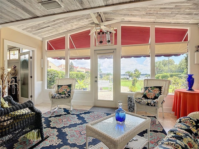 interior space with ceiling fan and wood ceiling