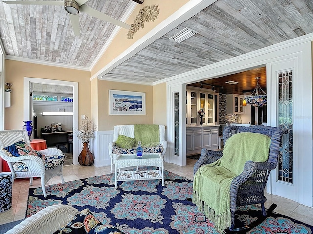 sunroom / solarium featuring ceiling fan and wood ceiling