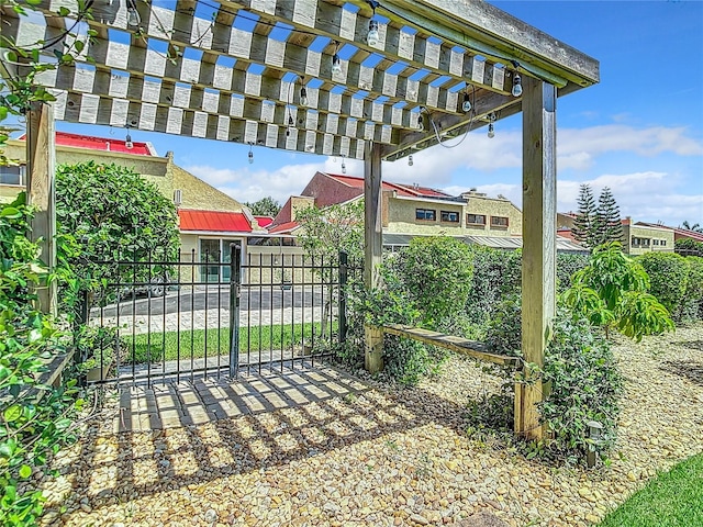 view of gate featuring a pergola