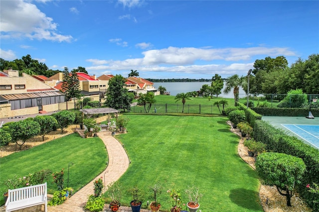 exterior space featuring a yard and a water view