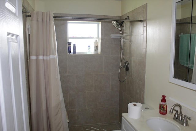 bathroom with vanity and a shower with shower curtain