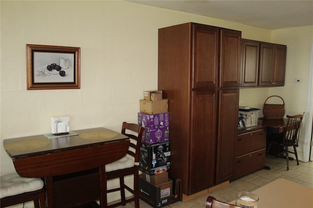 kitchen featuring light tile patterned flooring