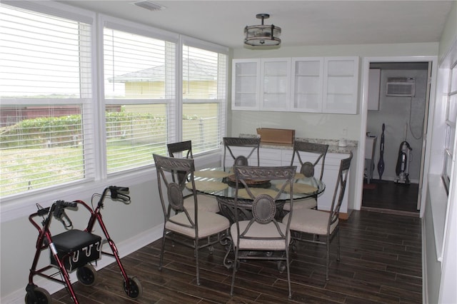 dining space with an AC wall unit