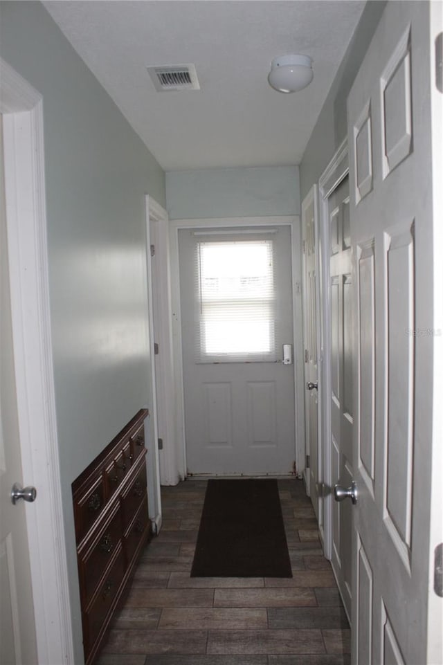 doorway to outside with dark hardwood / wood-style floors