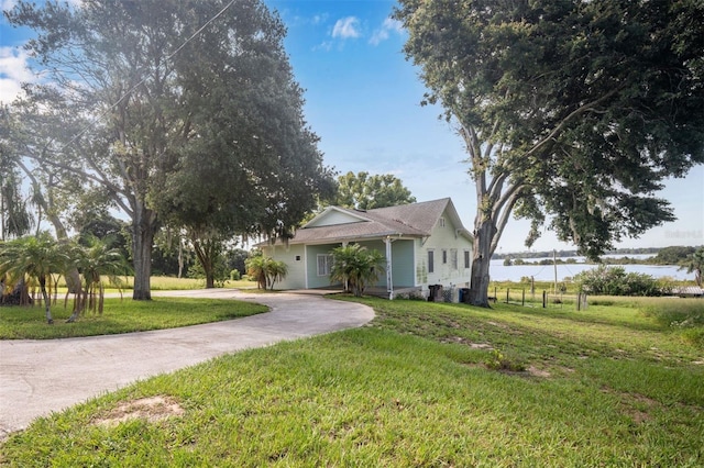 view of front of house featuring a water view and a front yard