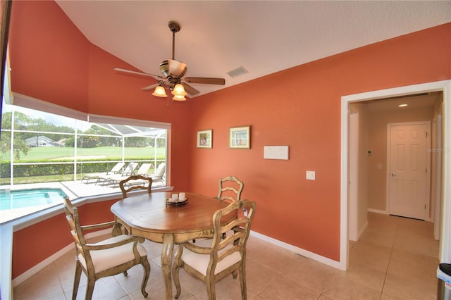 dining area featuring ceiling fan, light tile patterned floors, and a wealth of natural light