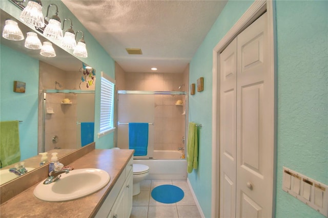 full bathroom featuring a textured ceiling, toilet, combined bath / shower with glass door, tile patterned floors, and vanity