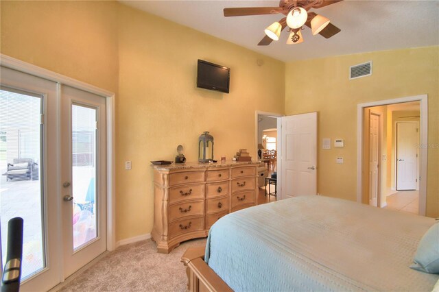 carpeted bedroom featuring ceiling fan, lofted ceiling, and access to exterior