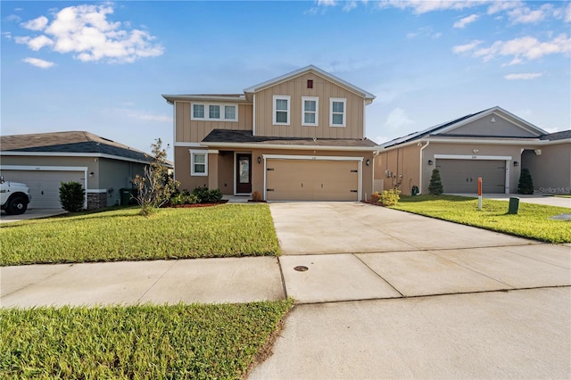 view of property with a garage and a front yard