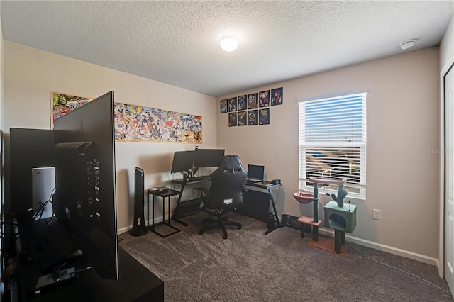 carpeted home office with a textured ceiling